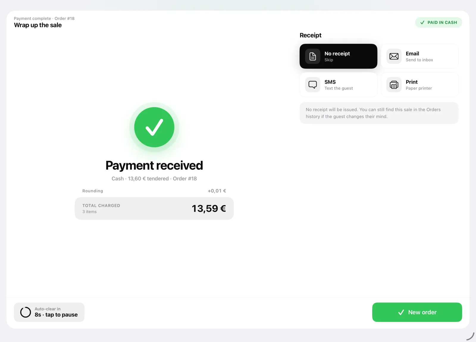The completed payment screen with the change due and receipt options: print, email or SMS