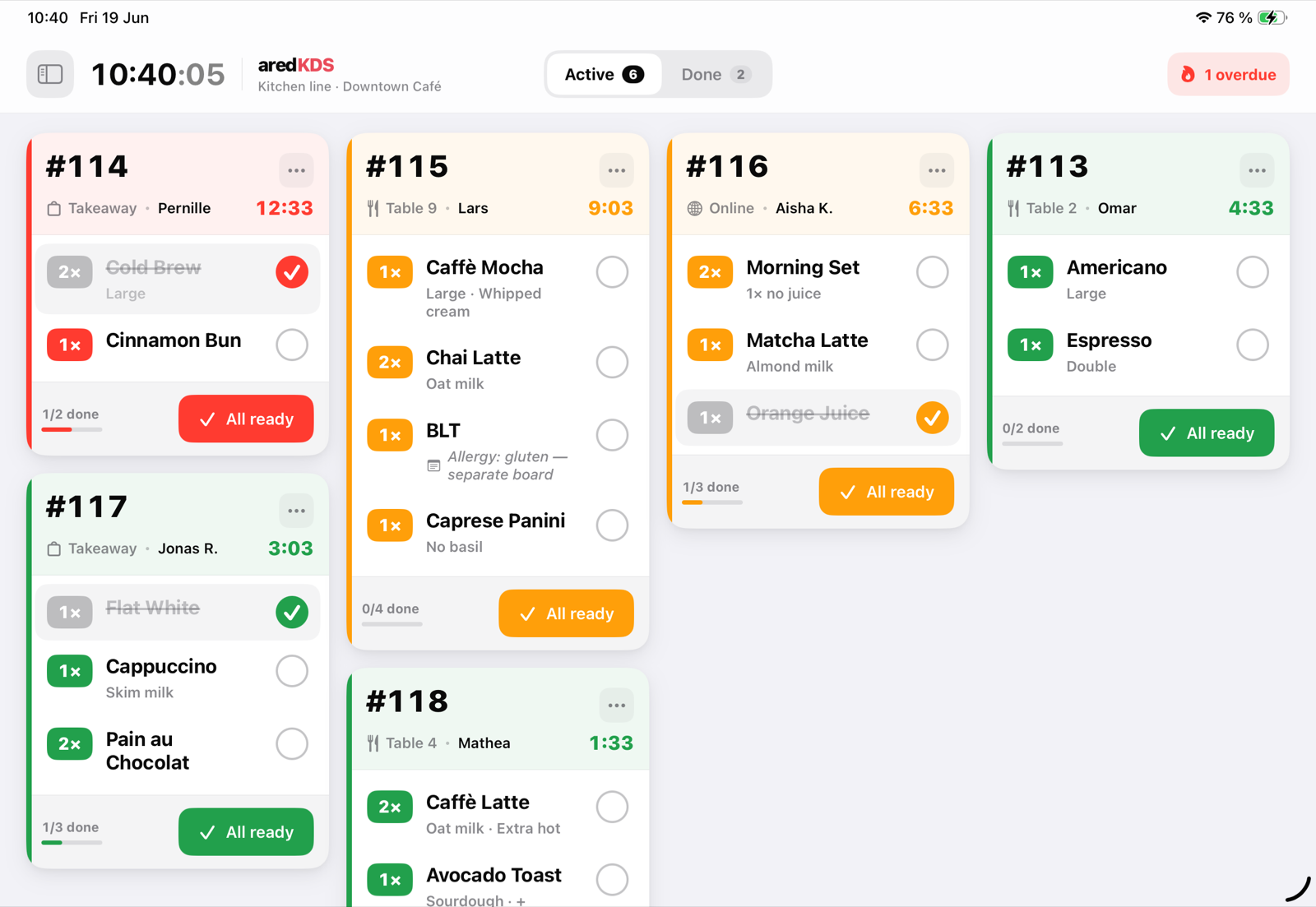The ared KDS kitchen board: order cards with dishes, waiting times and an “All ready” button